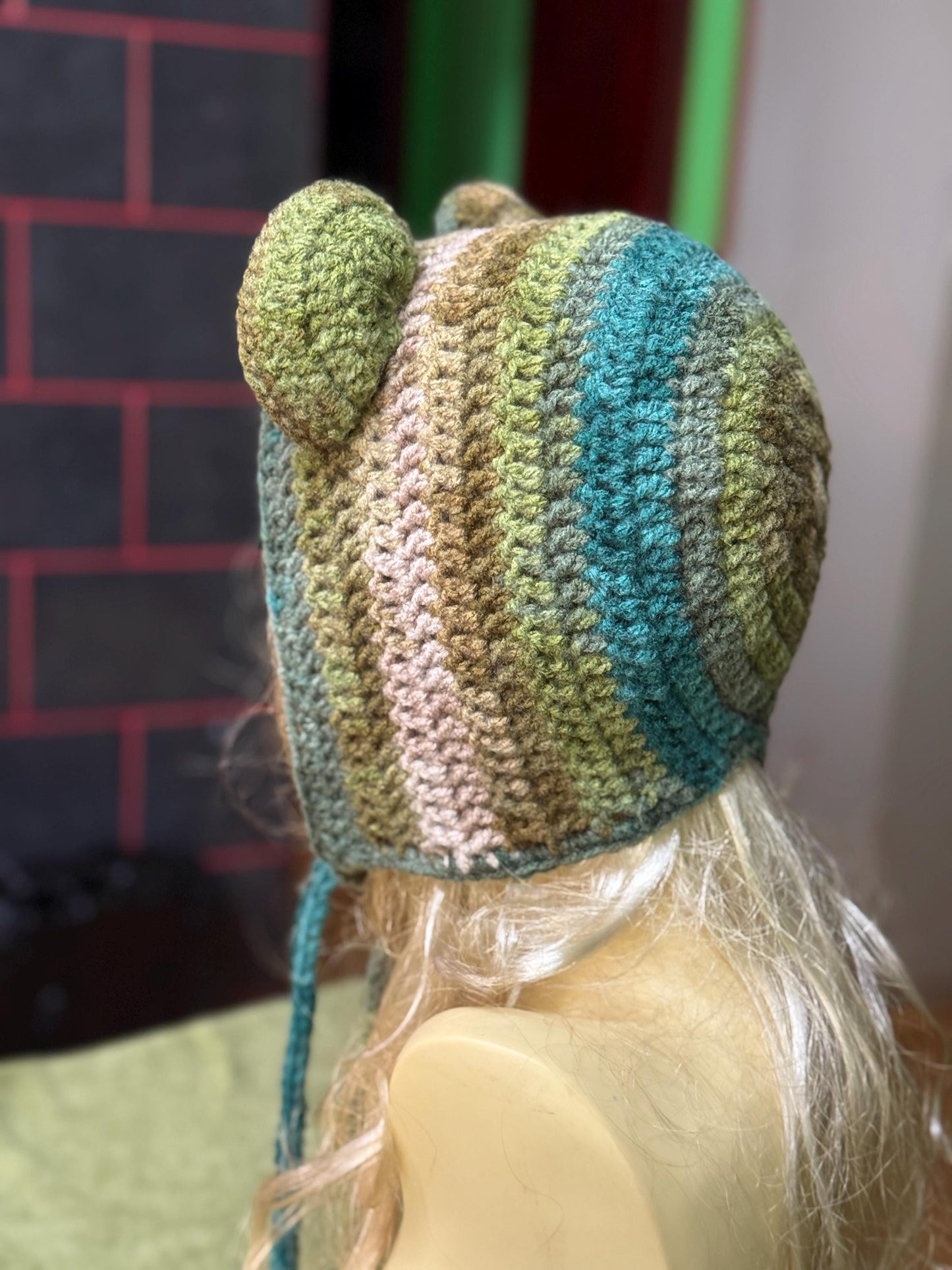 Crochet Bear Ear Bonnet with Ties, Sage Green Mossy Animal Hood, Forest Core Aesthetic Winter Hat, Handmade Bear Beanie with Pom Poms, Woodl